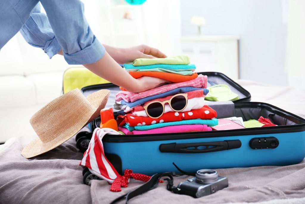 Woman packing clothes 
