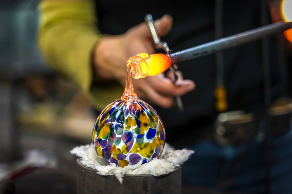 Man creating glass artwork