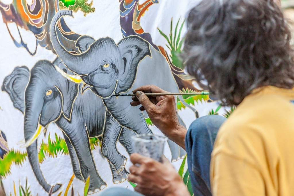 Artist painting in Tohpati Village